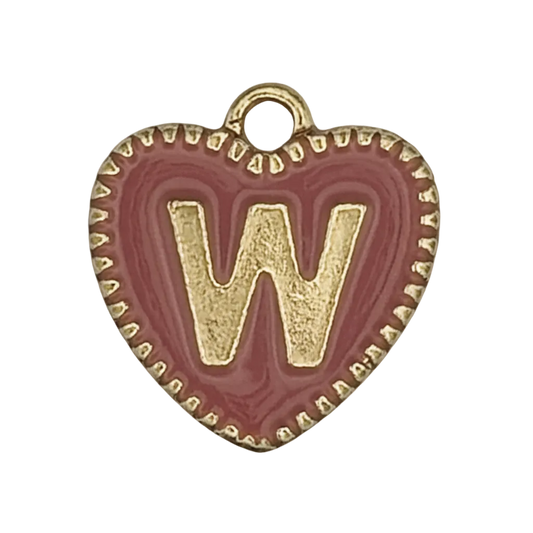 Close-up of red heart charm with gold letter W.
