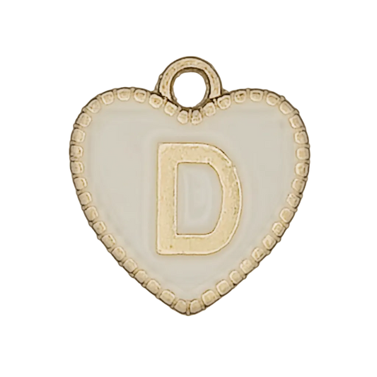 close-up of white enamel heart charm with raised gold letter D and dotted edge