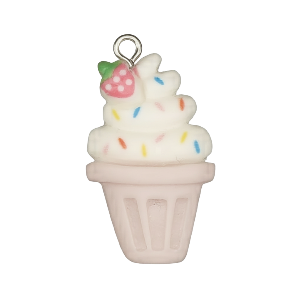 Close-up of a soft-serve ice cream cup charm with rainbow sprinkles and a small strawberry in a pink cup on a black background.