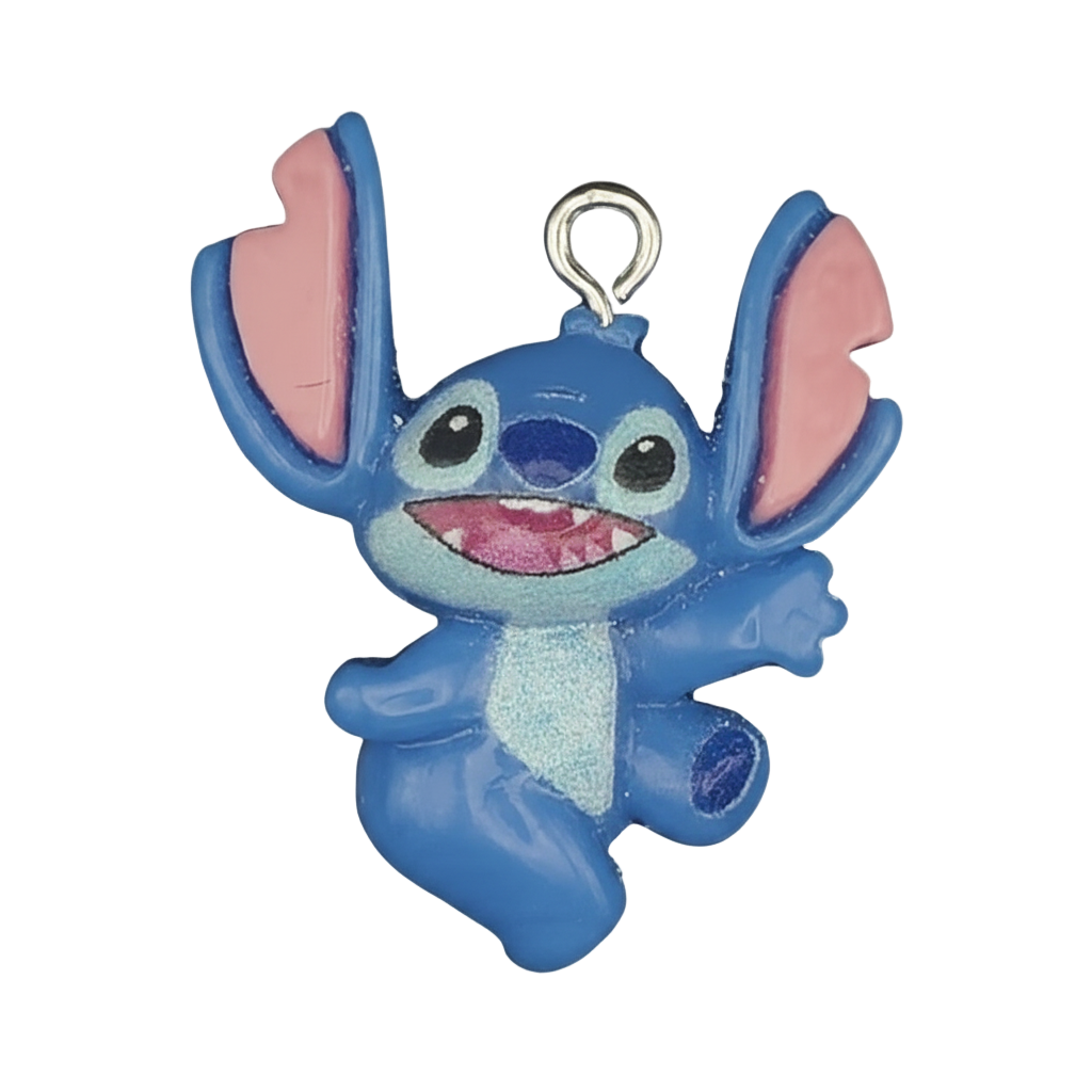 close-up of blue alien character charm with large pink ears on black background