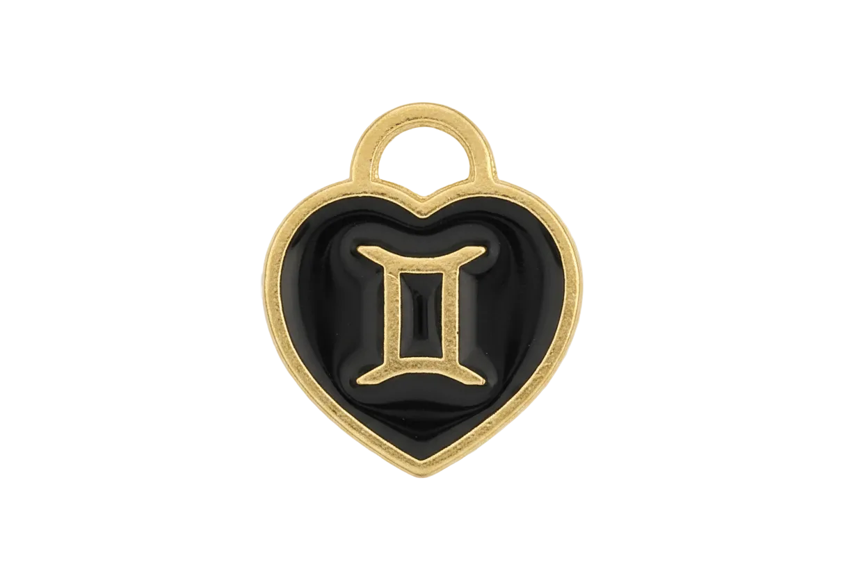 Close-up of a black heart-shaped charm with a gold-tone Gemini symbol.
