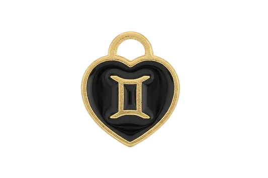 Close-up of a black heart-shaped charm with a gold-tone Gemini symbol.