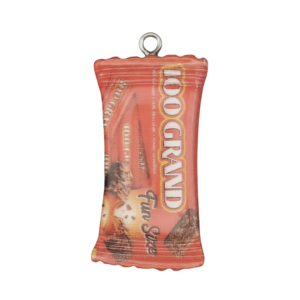 close-up of red '100 Grand' candy bar wrapper charm