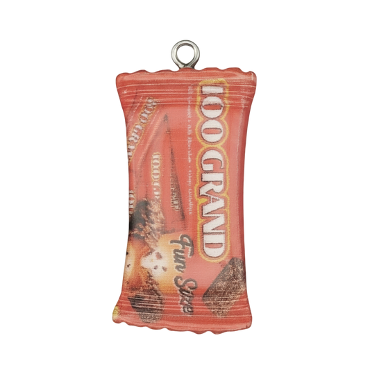 close-up of red '100 Grand' candy bar wrapper charm