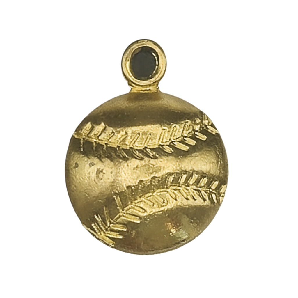 close-up of a gold baseball charm with stitched lines on a black background