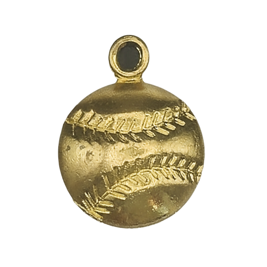 close-up of a gold baseball charm with stitched lines on a black background