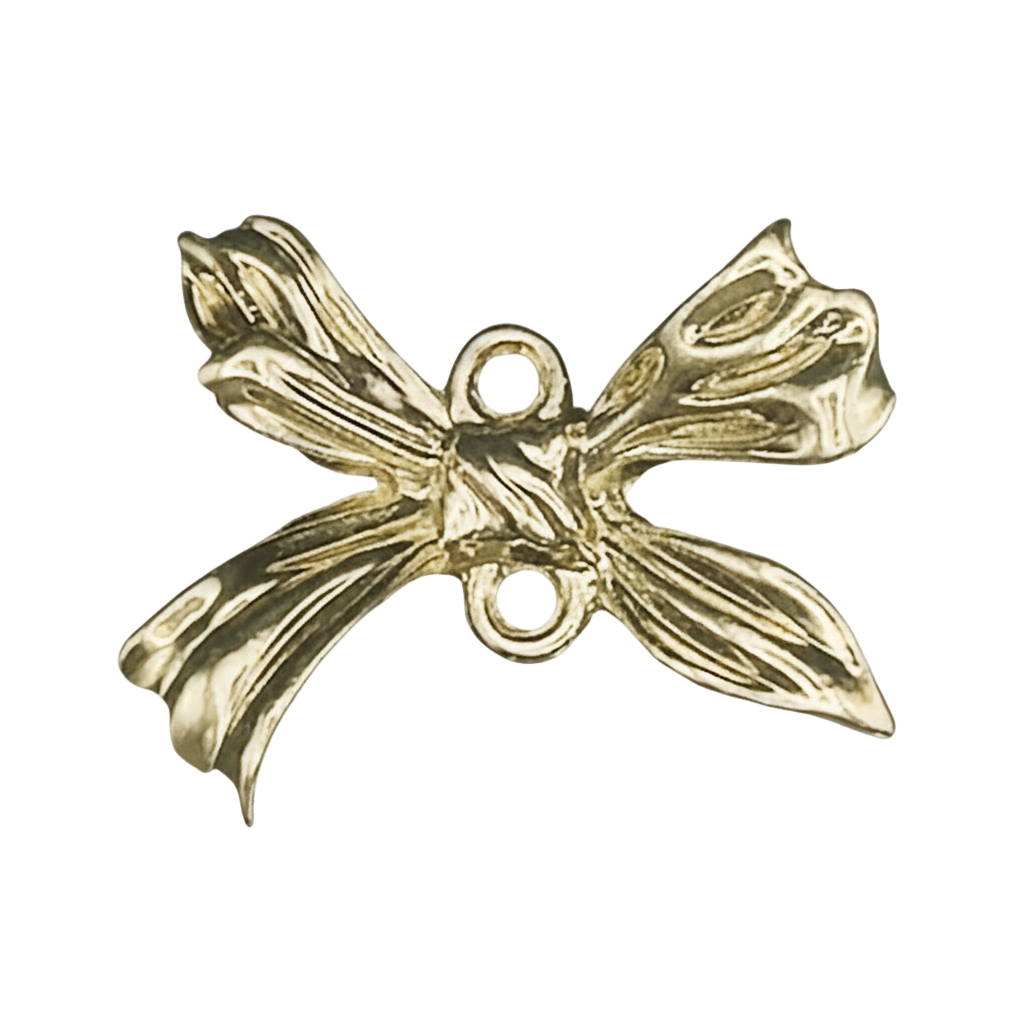 close-up of a gold-tone bow-shaped charm with two connector holes on a black background