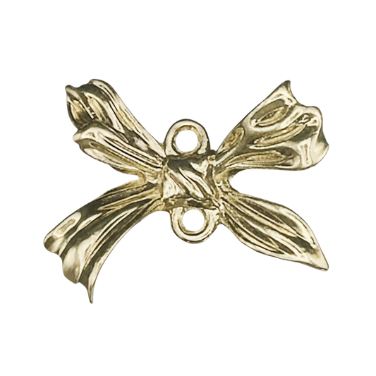 close-up of a gold-tone bow-shaped charm with two connector holes on a black background