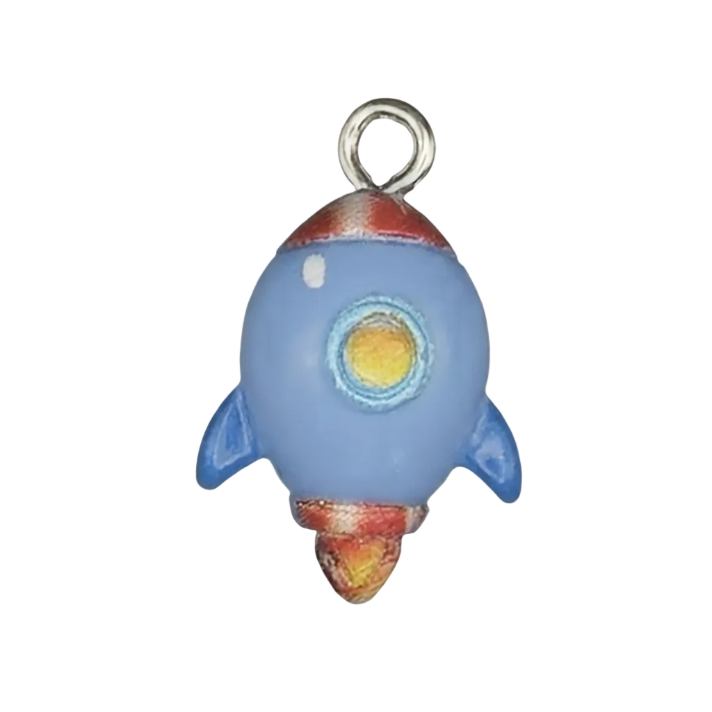 close-up of blue rocket ship charm with red and yellow details on a black background