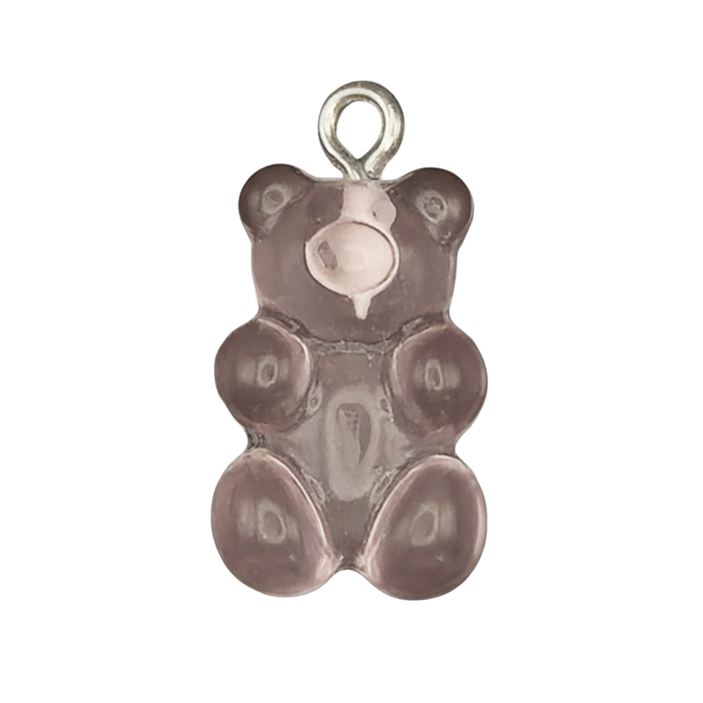 close-up of a translucent purple gummy bear charm with a small silver top ring on a black background