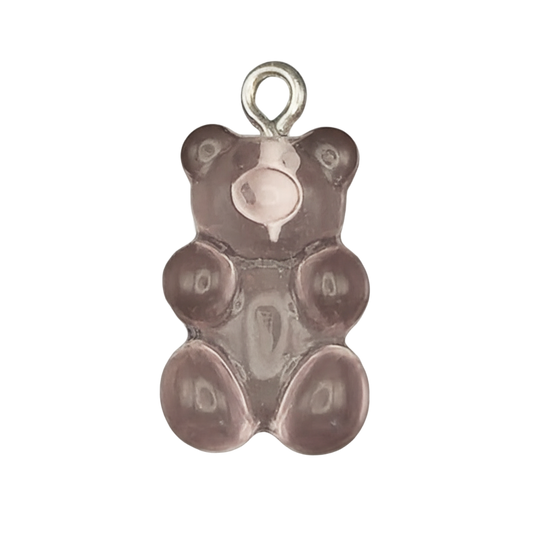 close-up of a translucent purple gummy bear charm with a small silver top ring on a black background