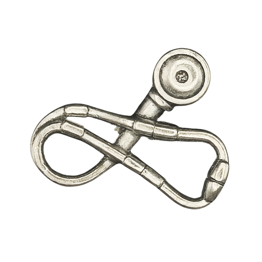 close-up of silver stethoscope-shaped charm on a black background