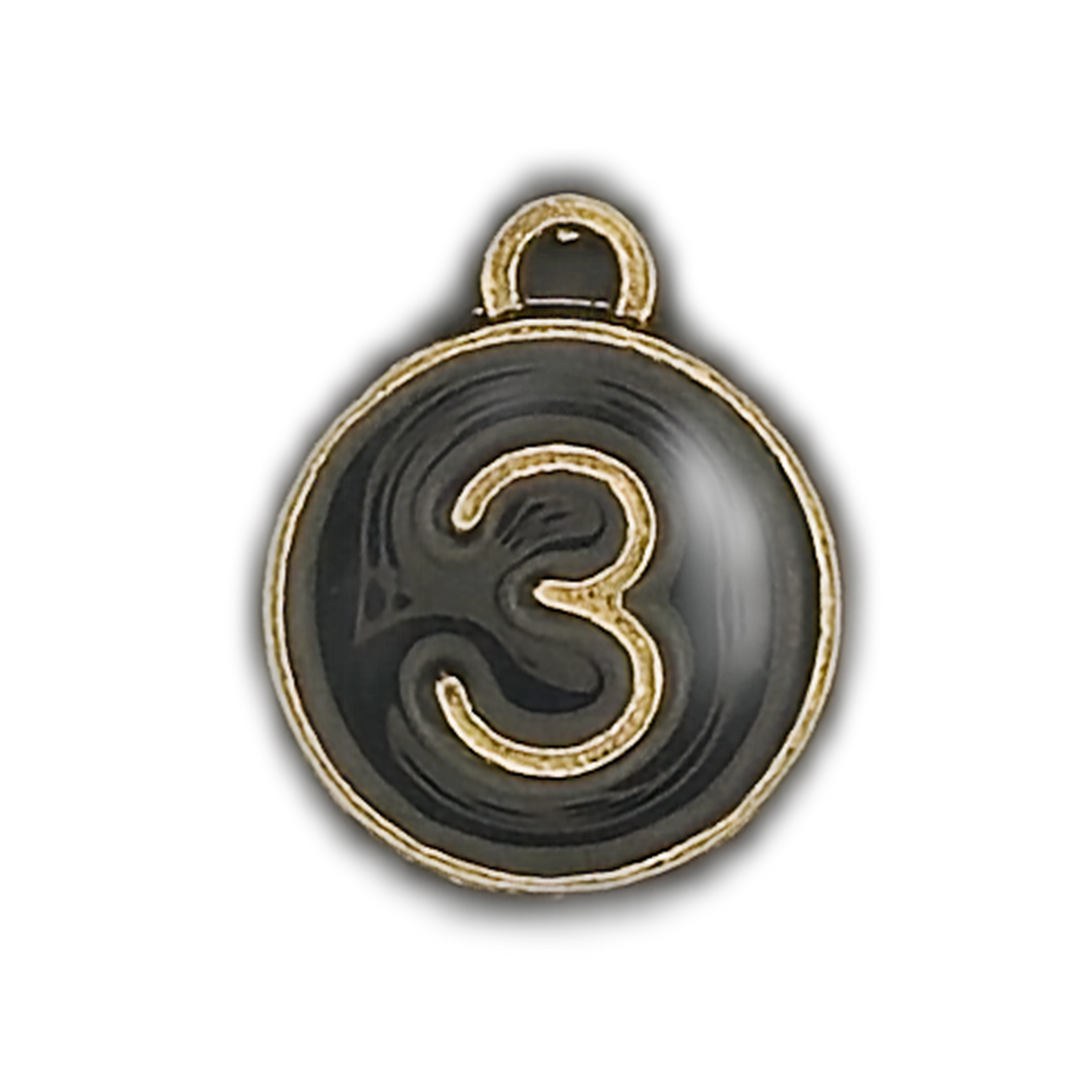 close-up of round black charm with gold number 3