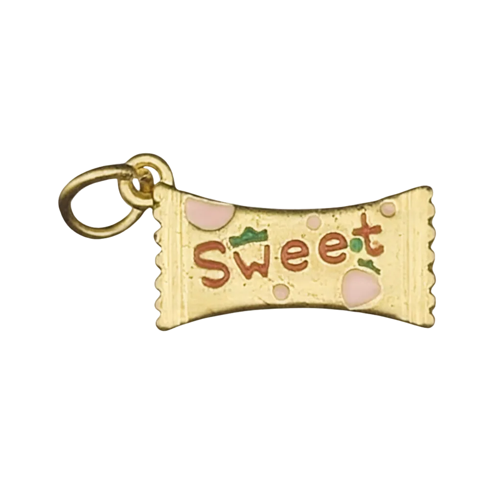 close-up of gold-tone candy wrapper charm reading “Sweet” with pink and green enamel on a black background