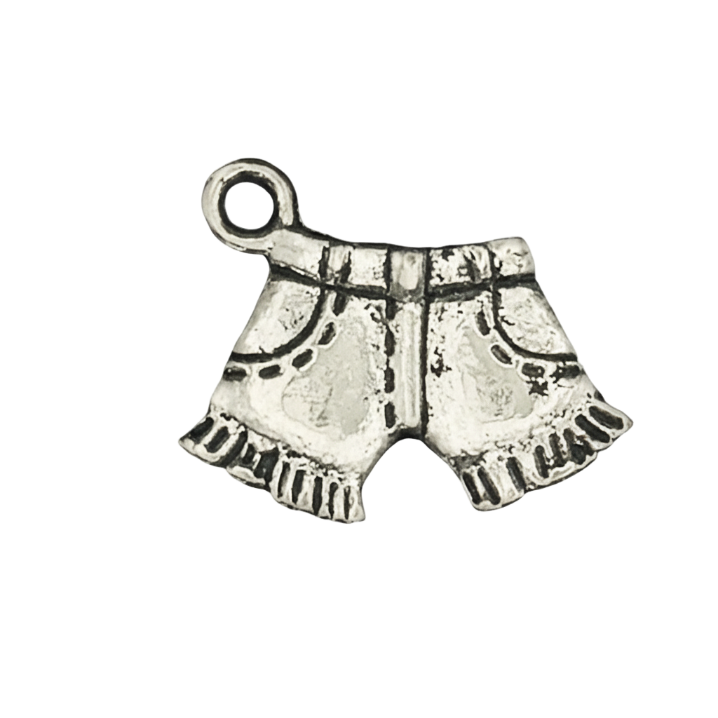 close-up of silver shorts-shaped charm with etched pockets and fringe