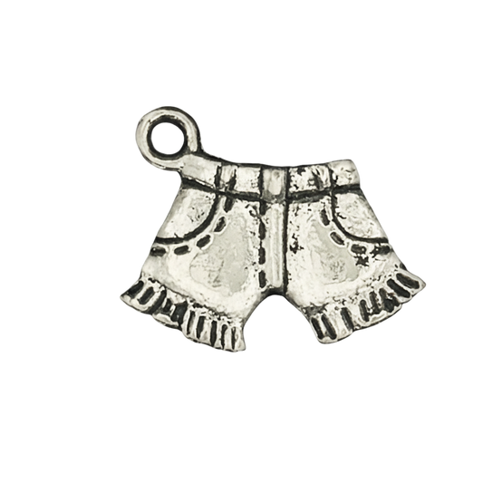 close-up of silver shorts-shaped charm with etched pockets and fringe