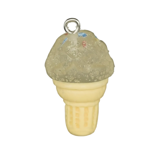 close-up of a small ice cream cone charm with a translucent scoop and cream cone on a black background