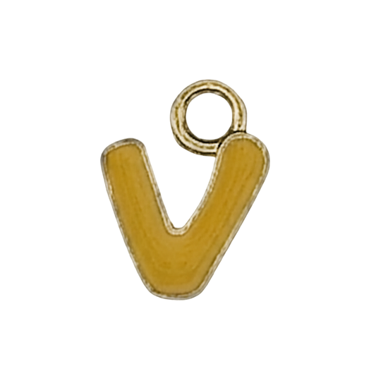 close-up of a small gold-tone lowercase letter v charm with yellow enamel on a black background