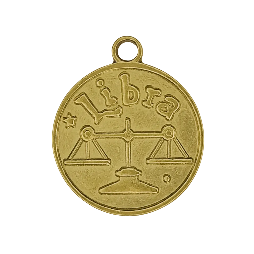 Close-up of round gold-tone charm with Libra scales and the word 'Libra'.