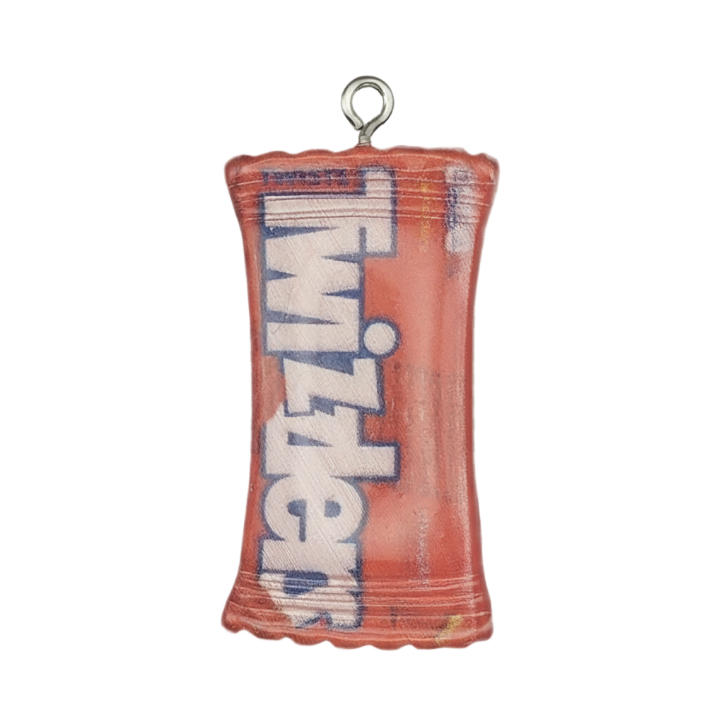 close-up of a small red Twizzlers candy bag charm with printed logo on a black background