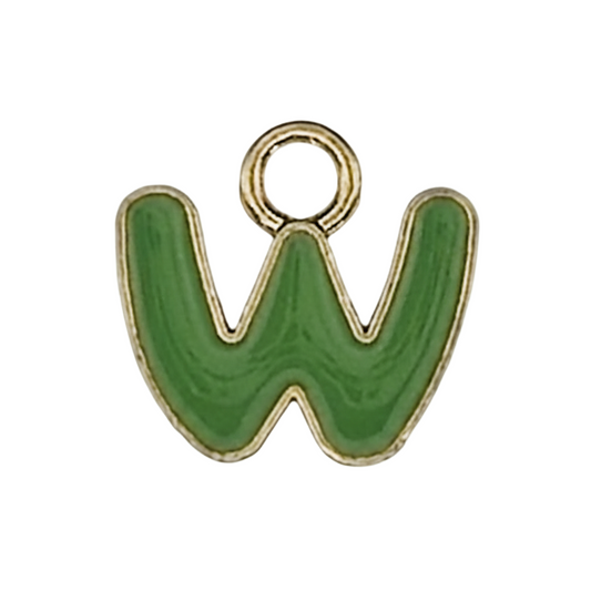 close-up of a green enamel letter W charm with gold outline on a black background