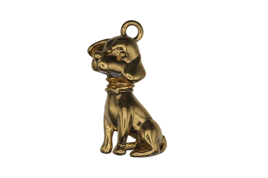 close-up of small gold sitting dog charm