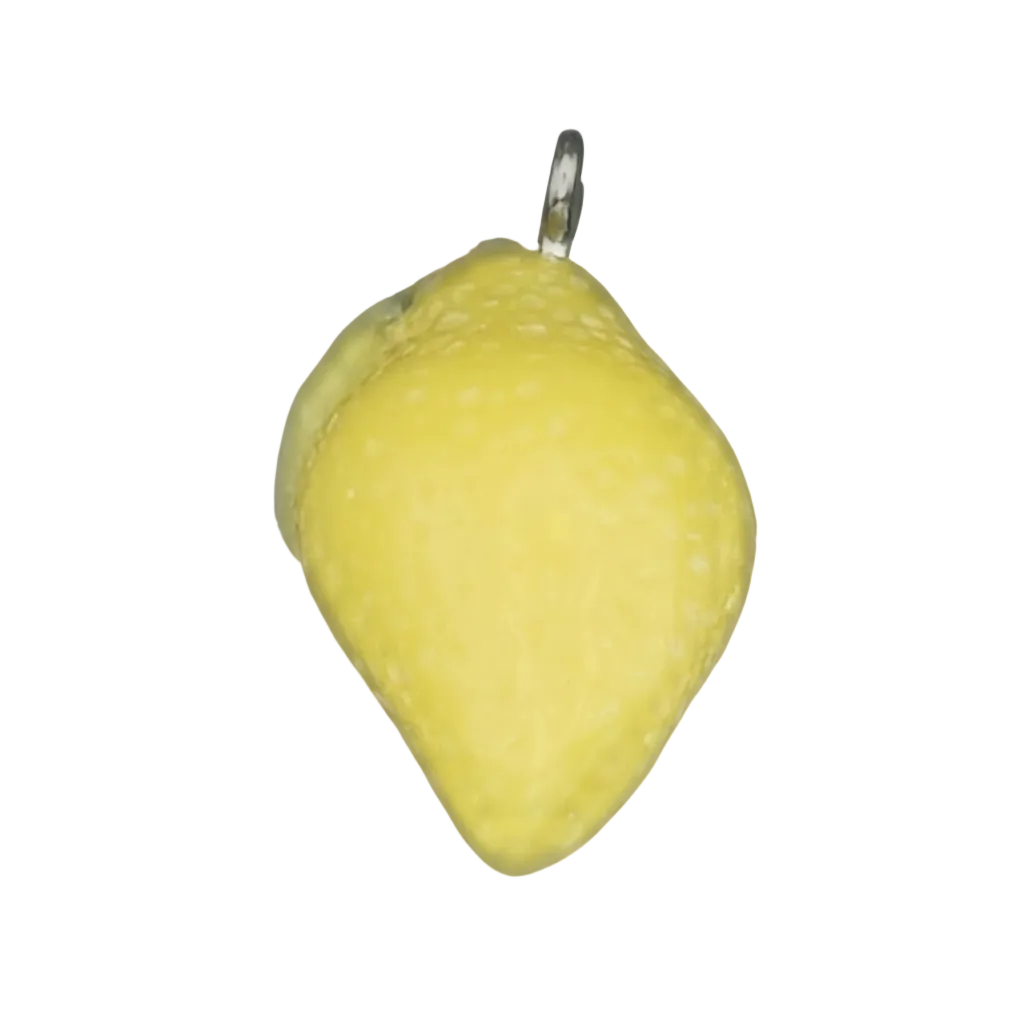 Close-up of a small yellow lemon-shaped charm on a black background.
