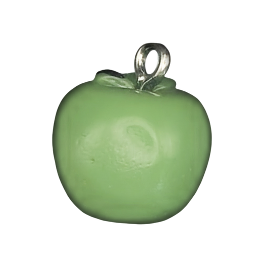 Close-up of a small green apple charm with a silver-tone top on a black background.