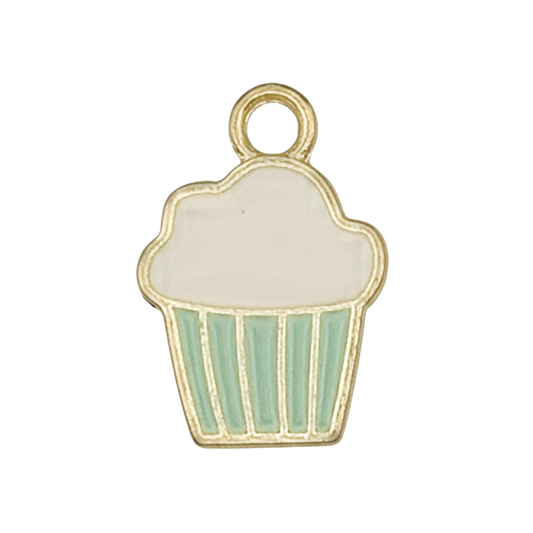 close-up of a gold-trimmed enamel cupcake charm with white frosting and mint green liner