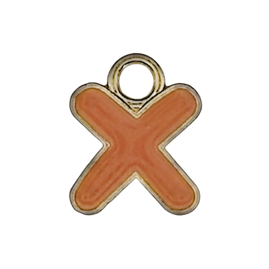 close-up of orange enamel letter X charm with gold outline on black background