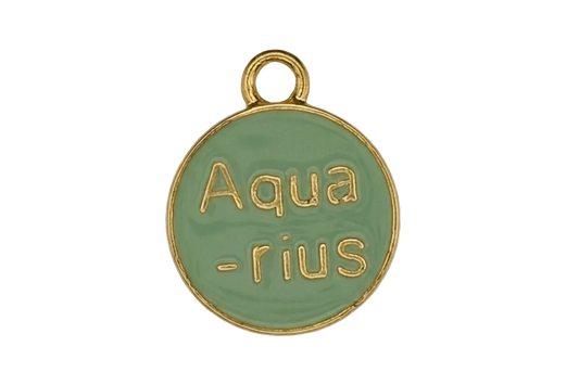 Close-up of a round green enamel charm reading "Aquarius" in gold.