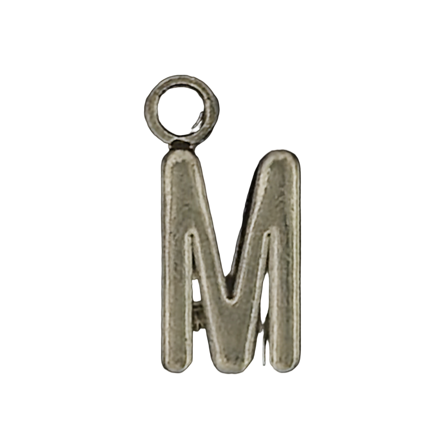 close-up of a silver metal letter M charm on a black background