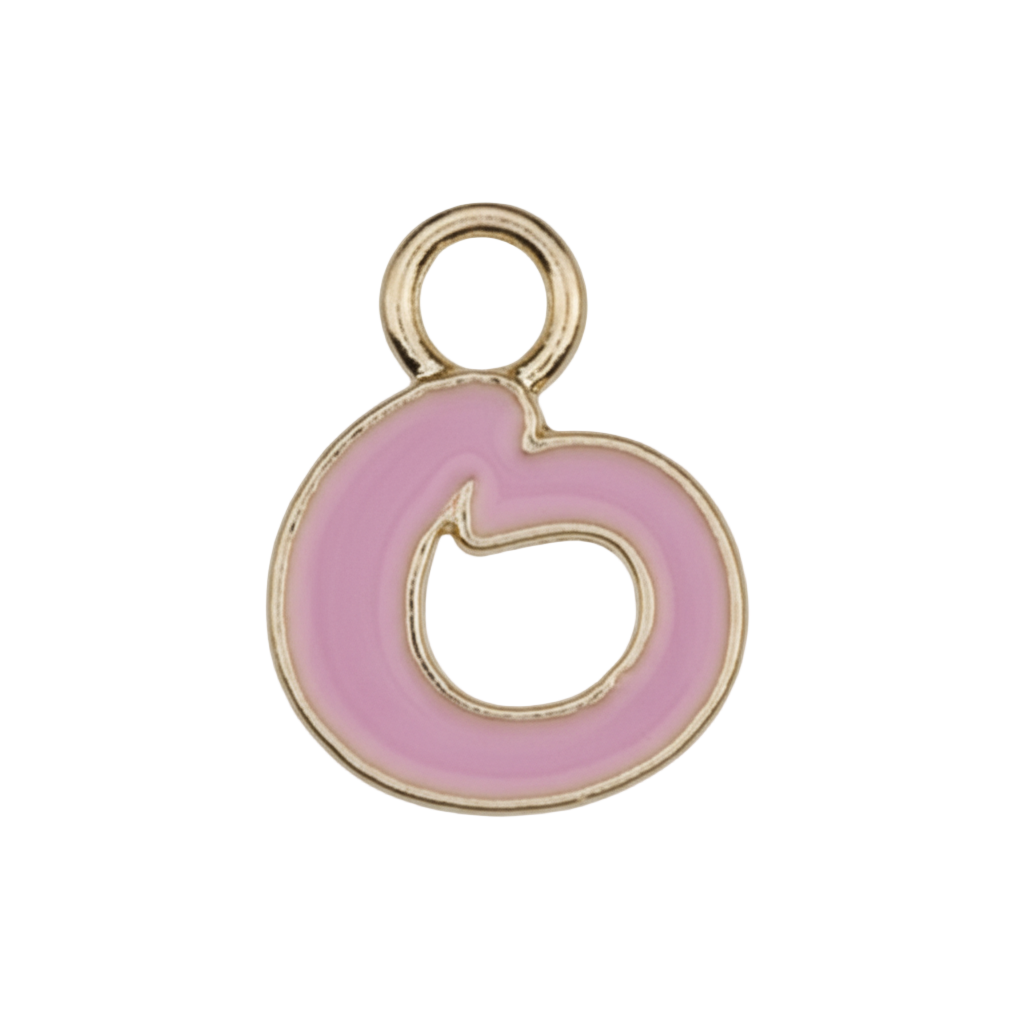 close-up of small pink enamel letter charm with gold-tone edges on a black background