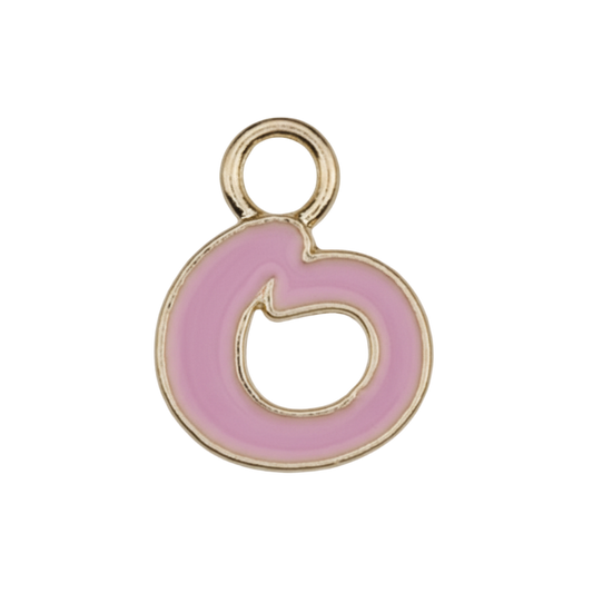 close-up of small pink enamel letter charm with gold-tone edges on a black background