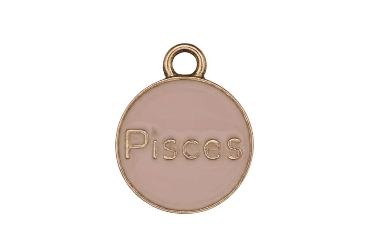 close-up of round pink enamel Pisces charm with gold-tone edge on black background