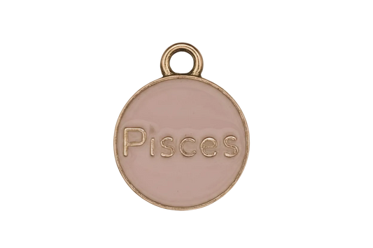 close-up of round pink enamel Pisces charm with gold-tone edge on black background