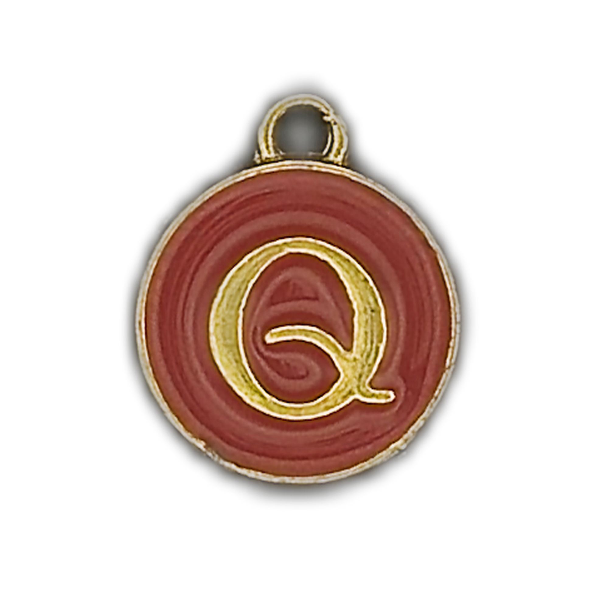 close-up of a small round charm with a gold Q on a red background