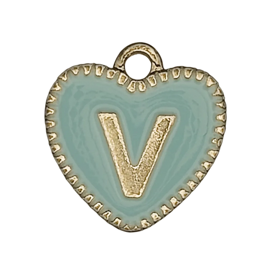 close-up of a small light blue enamel heart charm with a gold-tone letter V and border