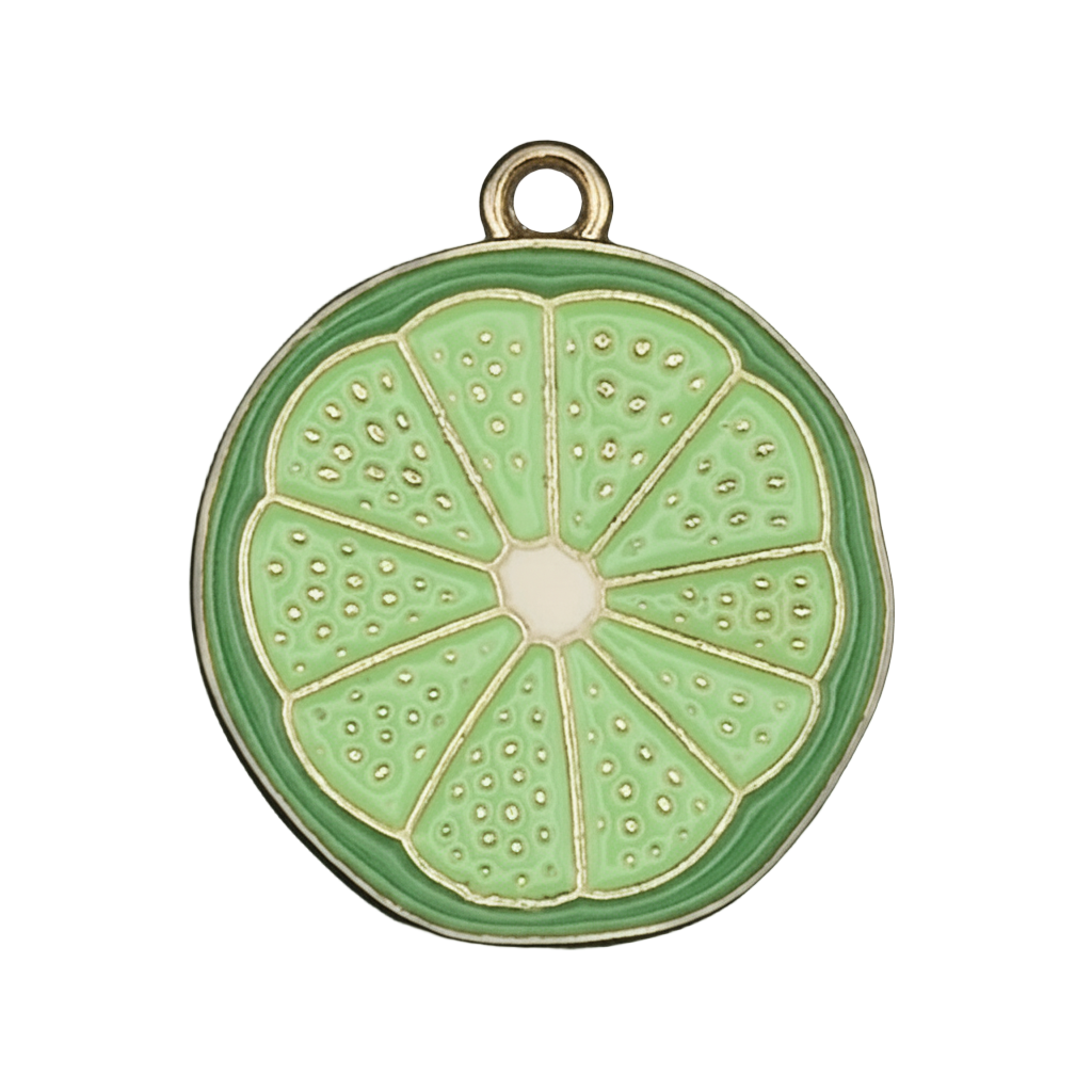close-up of green lime slice enamel charm with gold-tone edge on black background