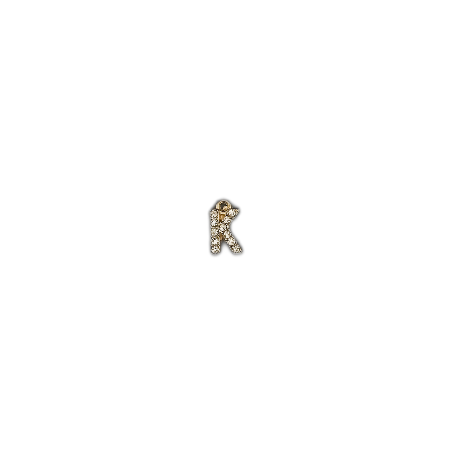 small letter K charm with clear stones centered on black background