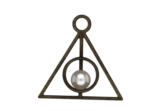close-up of antique brass triangle charm with a circle and vertical line on a black background