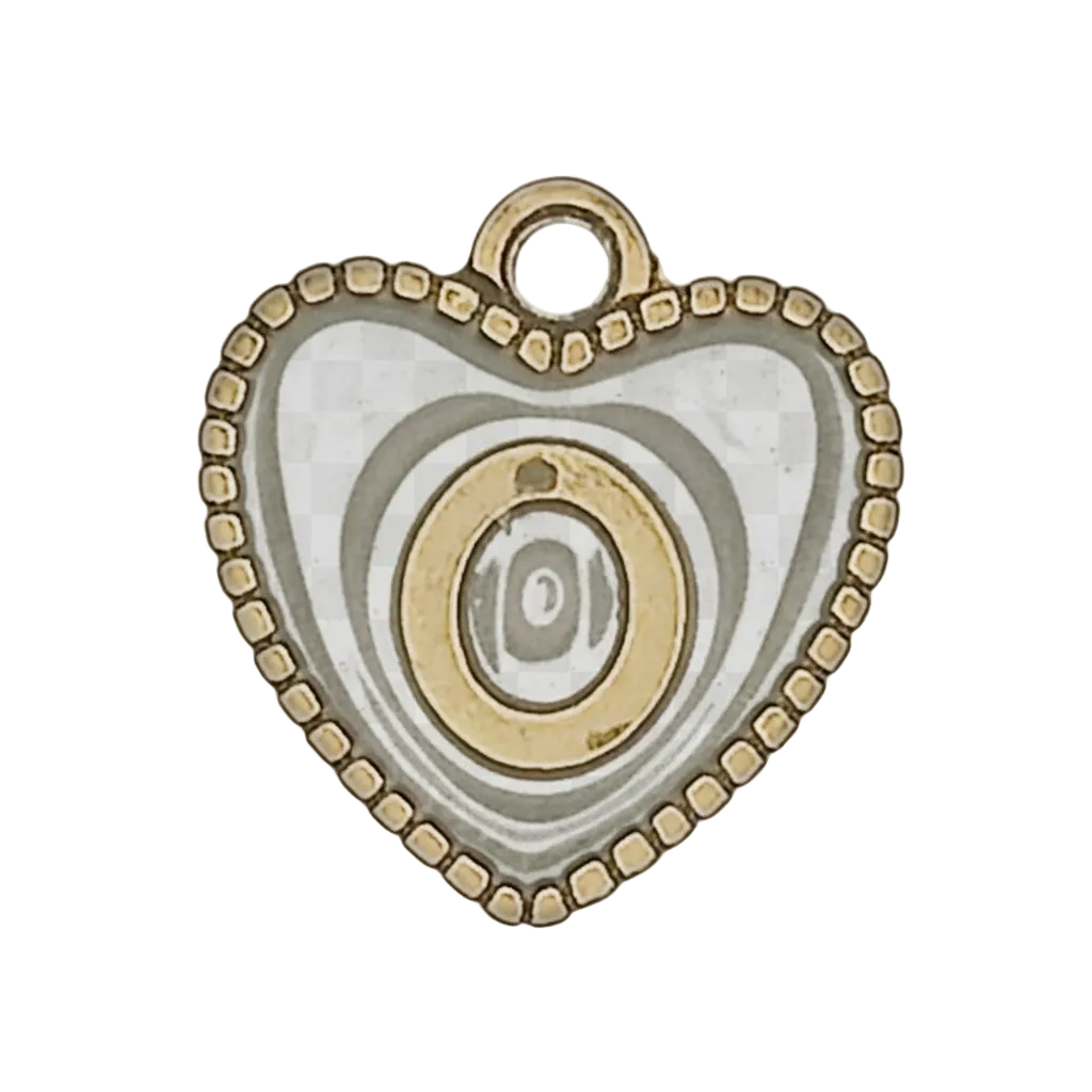 close-up of black and gold heart charm with eye motif