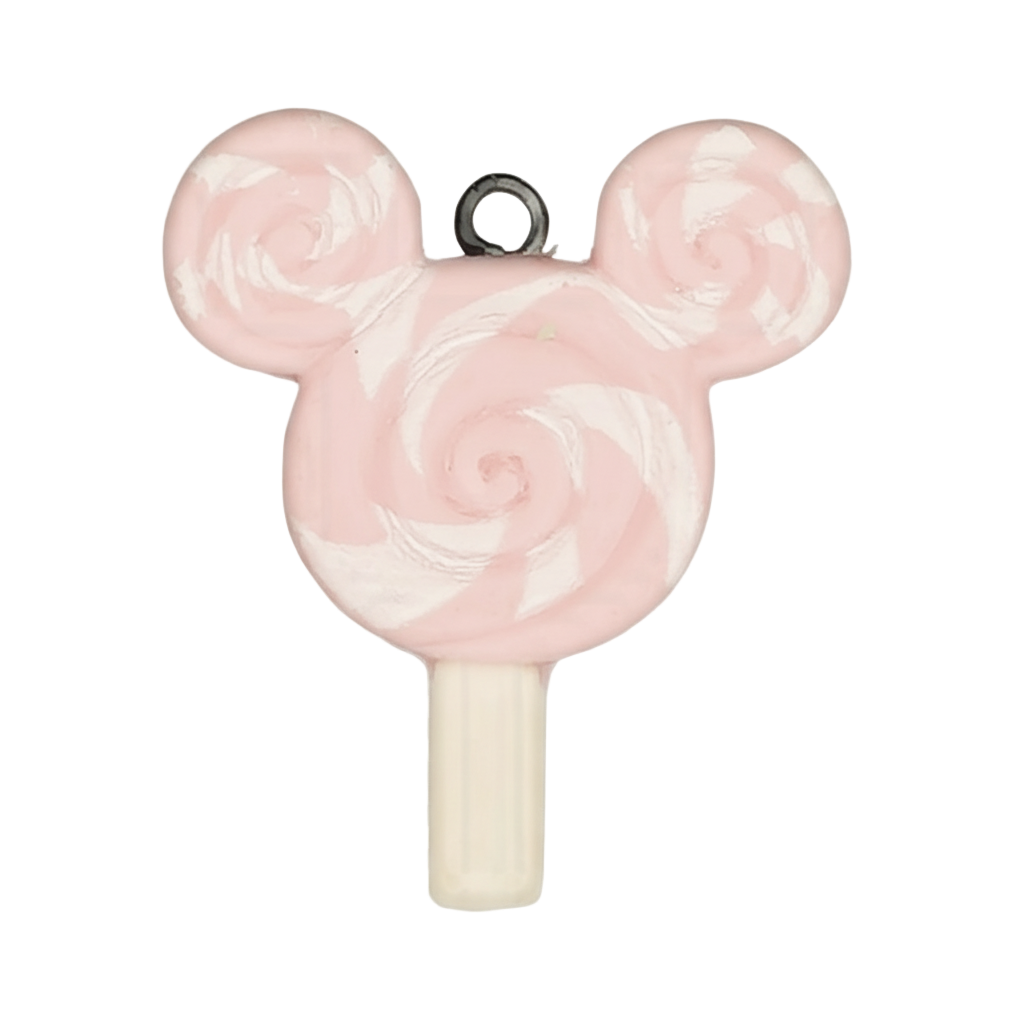 close-up of pink and white swirl lollipop mouse-head charm on black background