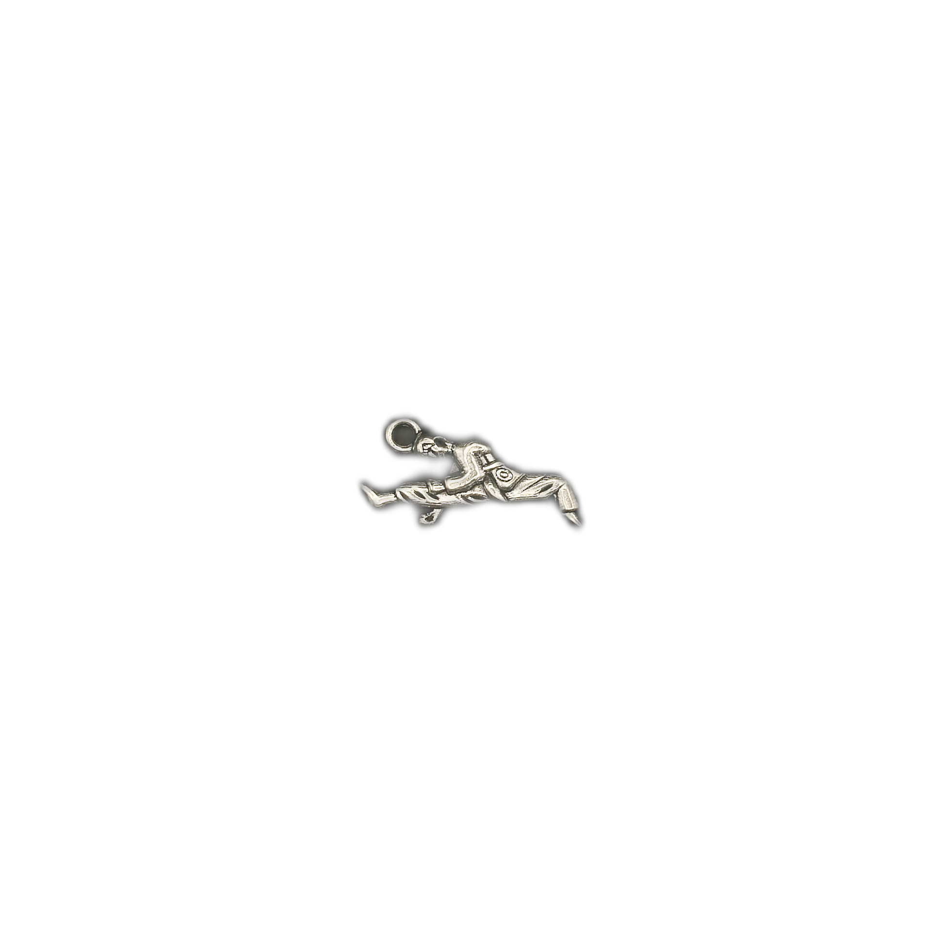 small silver-tone martial artist kick charm centered on black background
