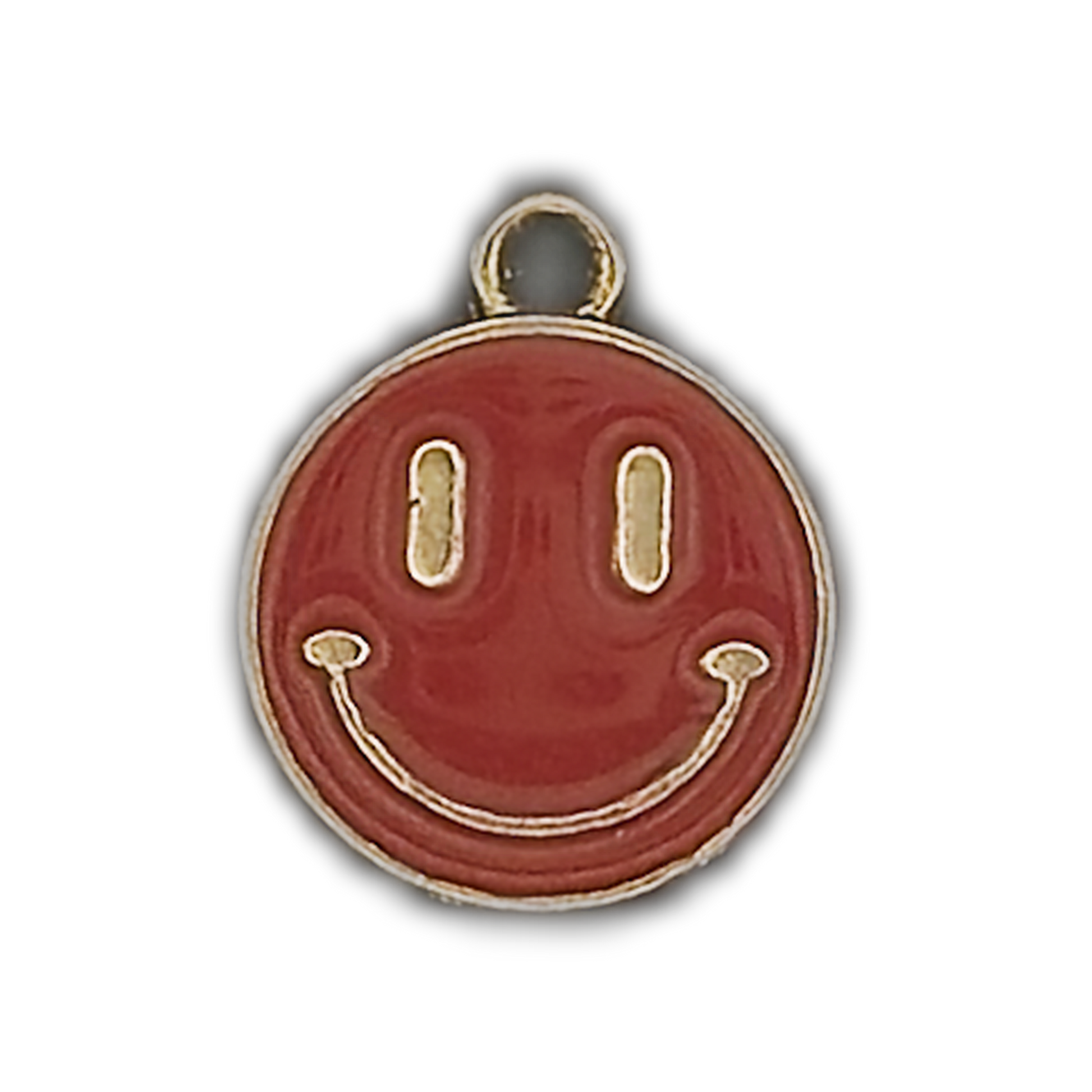 Close-up of a red enamel smiley face charm with gold outline on a black background.