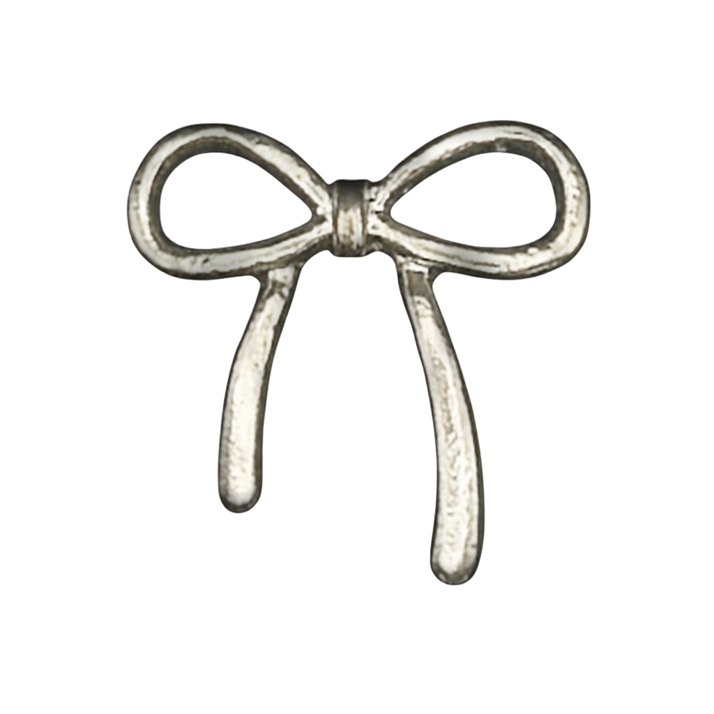 close-up of a small silver bow-shaped charm on a black background