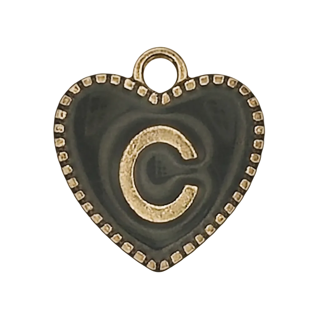 Close-up of black heart-shaped charm with gold letter C and dotted border.