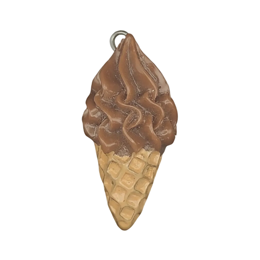 close-up of chocolate ice cream cone charm on black background
