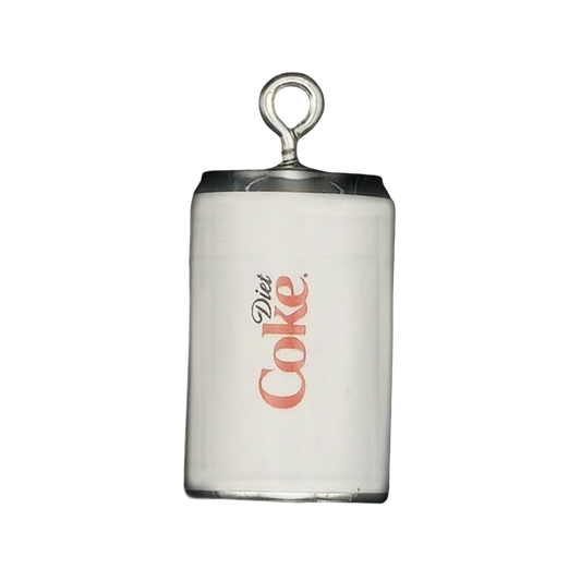 close-up of a white diet soda can charm with 'Diet Coke' text and a silver-tone top on a black background