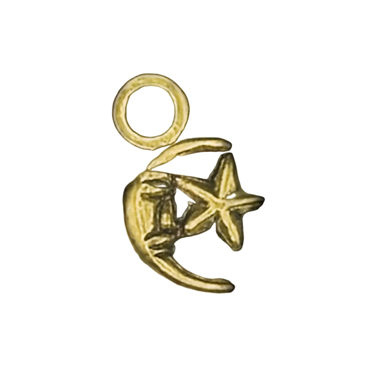 close-up of small gold crescent moon and star charm on black background